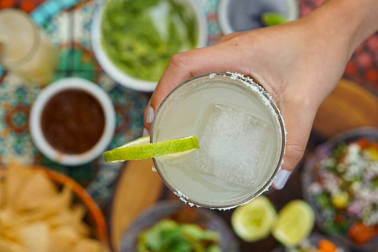 House Margarita over a variety of Happy Hour dishes