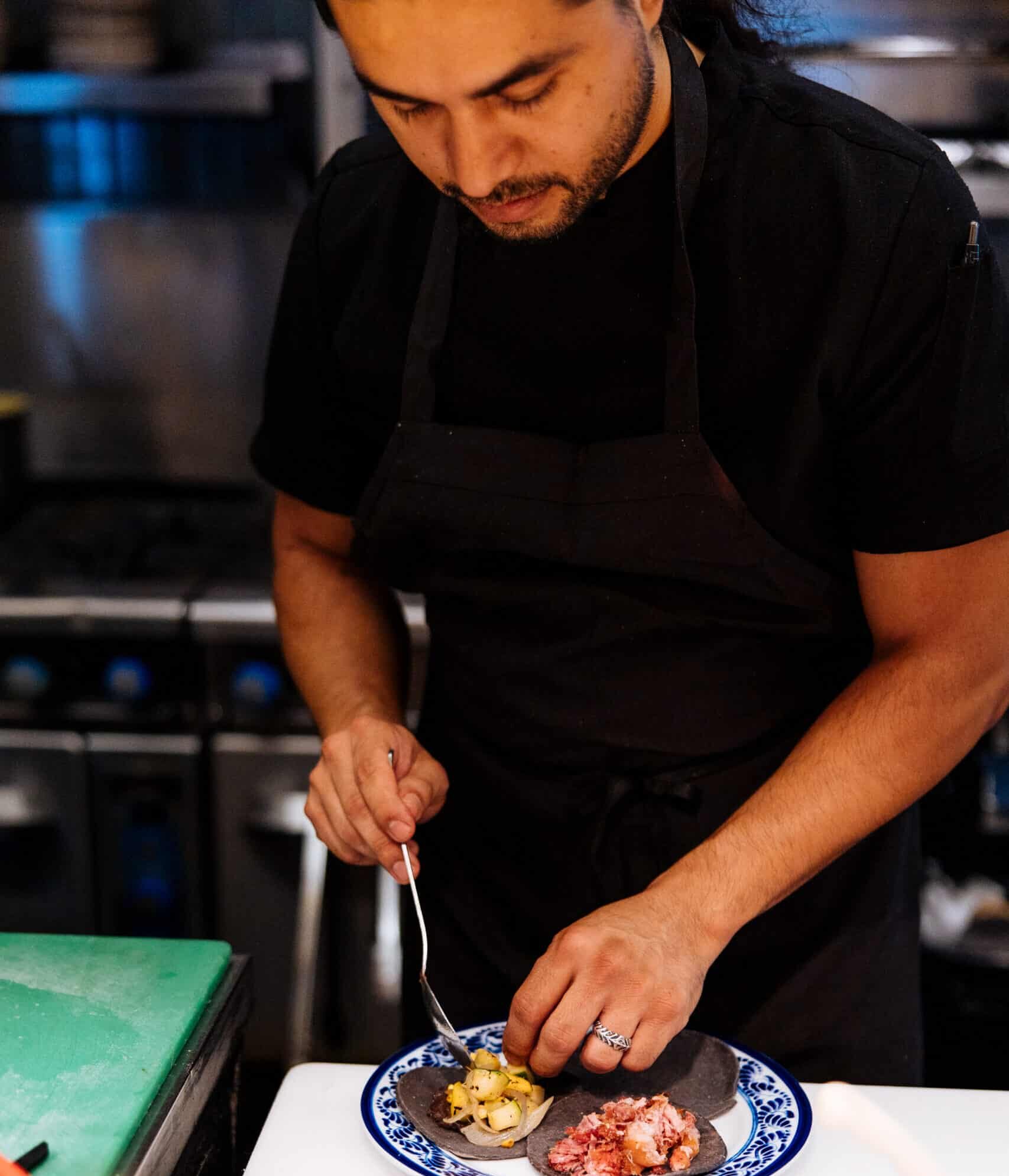 plating tacos in the kitchen